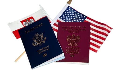 An American passport side by side with a Montenegrin passport on top of each country's specific flag.