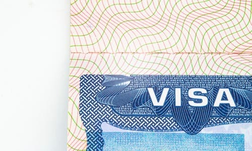 A closeup shot of the corner of visitor's visa.