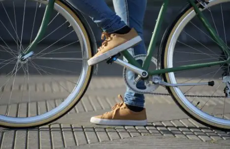 A person cycling in the city of Fresno.