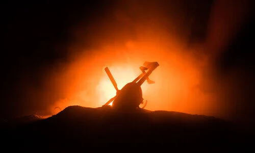 Silhouette of a helicopter burning after an aviation accident.