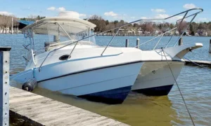 Boat sinking at a pier after sustaining damage.