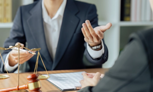 A Coarsegold personal injury lawyer sharing legal advice with her client.